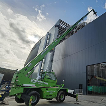 A crane helping to fit cladding